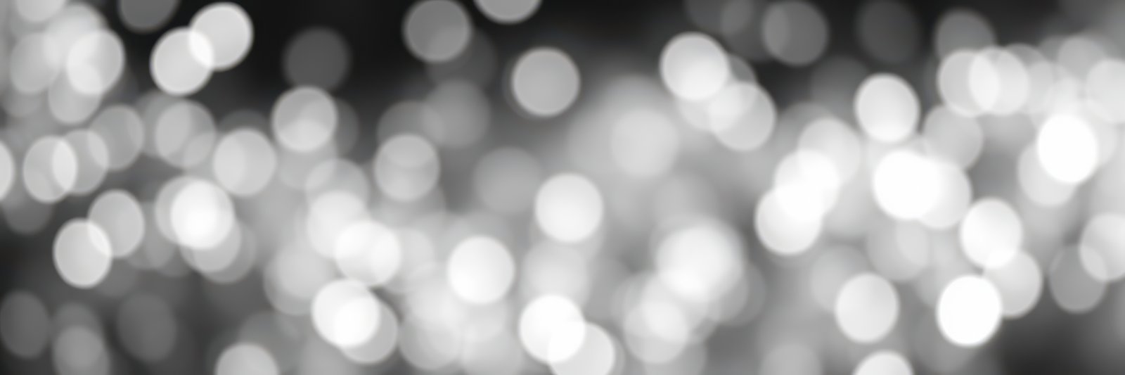 Sparkling bokeh lights create a dreamy atmosphere at a festive evening gathering